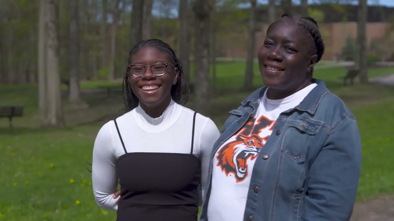 Mother and daughter smiling